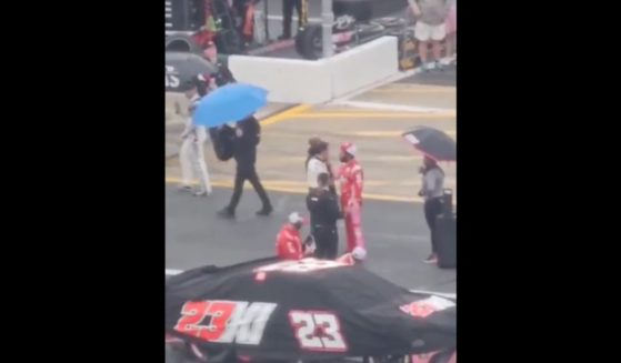 Aric Almirola and Bubba Wallace go face to face before Almirola shoved Wallace during a rain delay at the Coca-Cola 600 NASCAR race in North Carolina on Monday.
