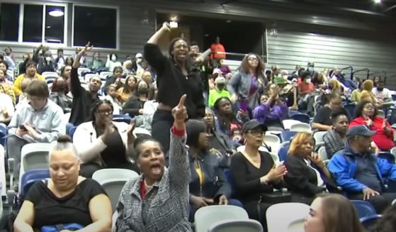 Angry residents speak out about Chicago's plans for illegal immigrants during a recent city meeting.
