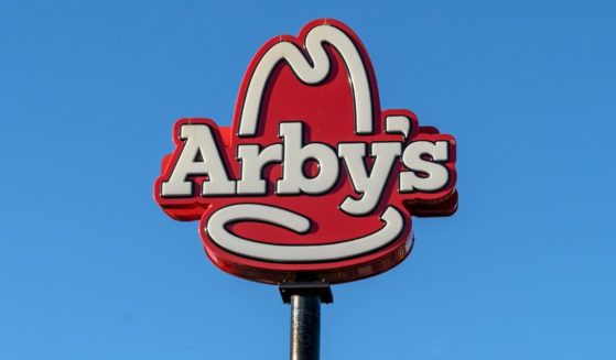 An Arby's sign is seen atop a pole in Orlando, Florida, on Jan. 31, 2022.