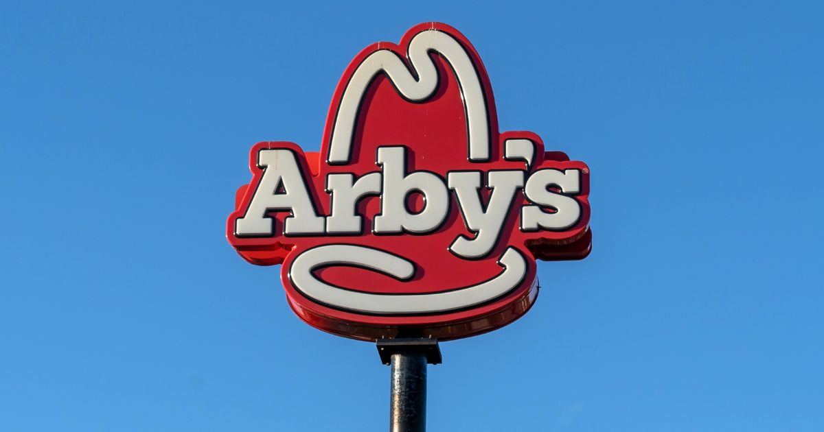An Arby's sign is seen atop a pole in Orlando, Florida, on Jan. 31, 2022.