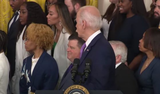 The White House cut a live broadcast of a speech on Friday after a woman standing behind President Joe Biden collapsed.