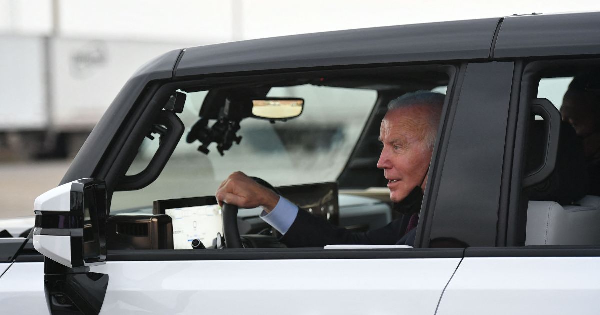 President Joe Biden test drives an electric Hummer as he tours the General Motors electric vehicle assembly plant in Detroit on Nov. 17, 2021.