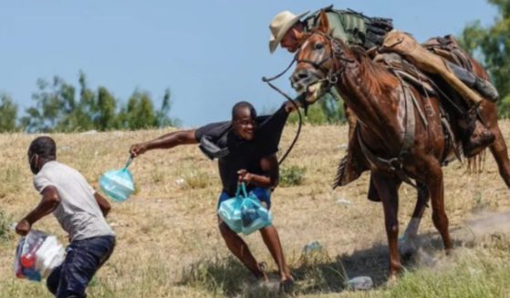 In September 2021, this photograph circulated after many alleged an illegal immigrant was being whipped; however, these claims were proved to be untrue as the rope in the image was determined to be the reins from the horse.