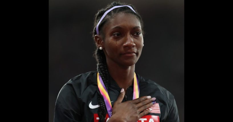 Tori Bowie cries on the podium during the national anthem after winning a gold medal in the women's 4x100m relay final at the 16th IAAF World Athletics Championships in London on Aug. 13, 2017.