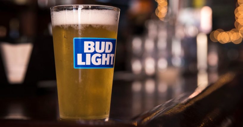 A glass of Bud Light is seen in a New York City bar in this file photo from July 2018. Several Chicago gay bars have declared a boycott of Bud Light and other brews by Anheuser Busch InBev after the company distanced itself from a controversial marketing campaign involving a transgender influencer.