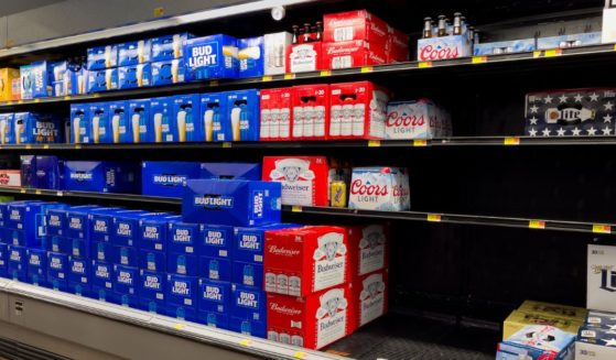Stacks of Bud Light beer are displayed next to empty shelves for other brands at a grocery store in Atlanta on Friday.