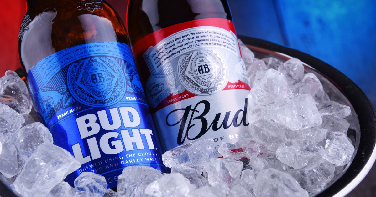 Bottles of Bud and Bud Light are seen on ice in Poznan, Poland, on April 9, 2020.