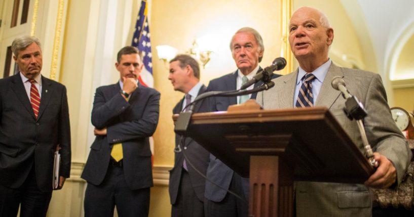 Sen. Ben Cardin of Maryland, right, flanked by other Democrats, speaks during a news conference on Capitol Hill in Washington on Aug. 21, 2018.
