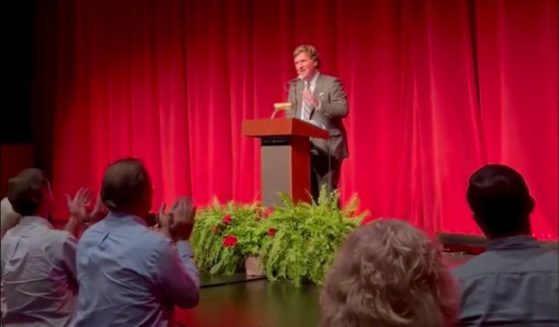 A crowd gave Tucker Carlson a lengthy standing ovation after he was introduced.