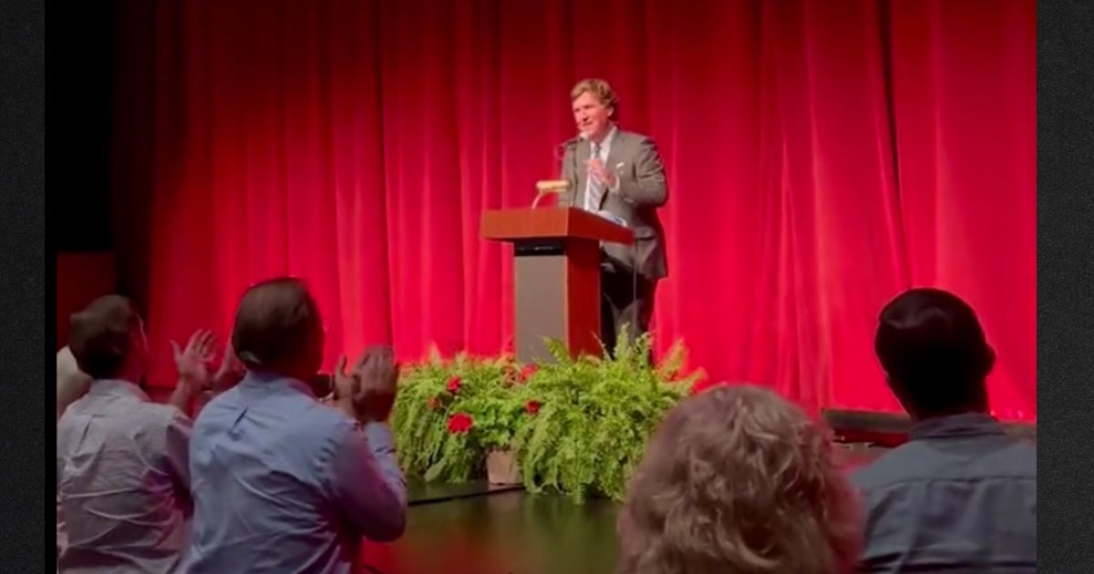 A crowd gave Tucker Carlson a lengthy standing ovation after he was introduced.