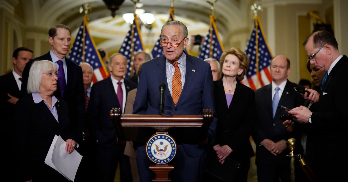 Senate Majority Leader Charles Schumer, center, and his committee chairs talk to reporters about their proposed China competitiveness legislation in the U.S. Capitol in Washington, D.C., on May 3.