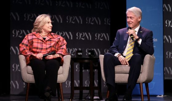 Hillary Clinton and President Bill Clinton speak onstage during an event in New York on May 4.