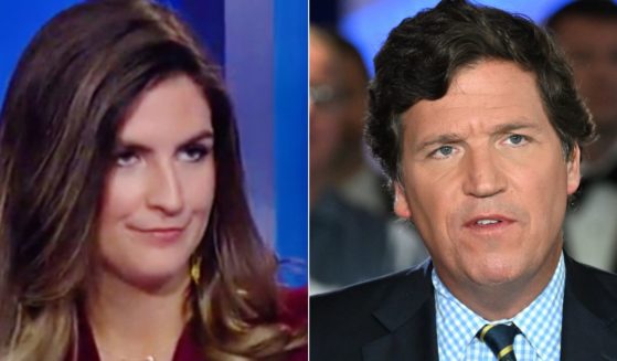 In 2017, then-Fox News host Tucker Carlson, right, interviewed Kaitlan Collins, left, and she defended then-President Donald Trump.