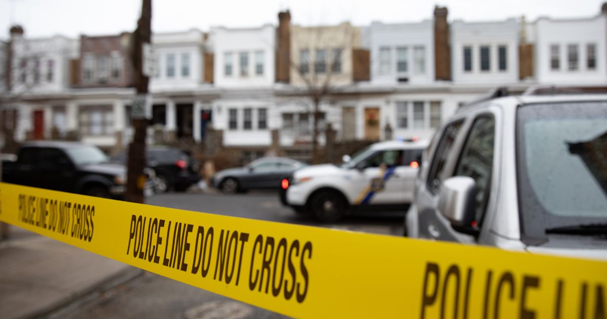 Police tape is hung outside of a fatal fire scene in Philadelphia, Pennsylvania, on Jan. 5, 2022.