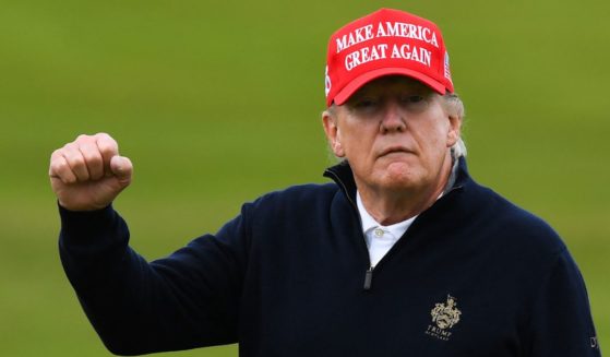 Former President Donald Trump reacts as he plays golf in Turnberry on the west coast of Scotland on May 2.