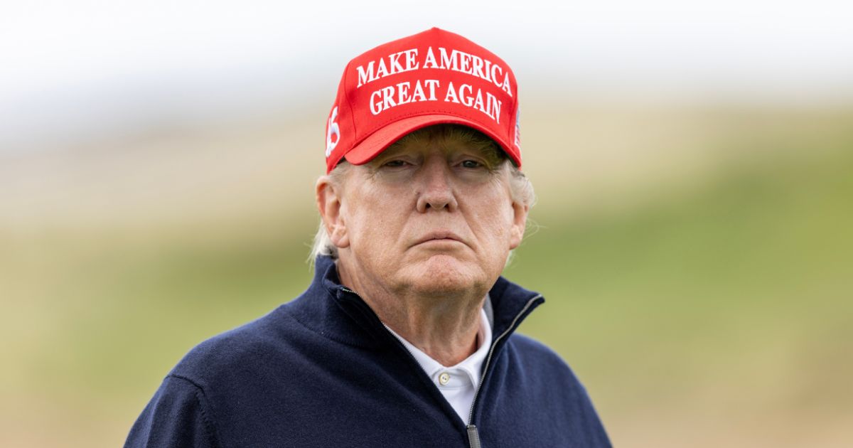 Former President Donald Trump plays a round of golf at his golf course in Turnberry, Scotland, on May 2.