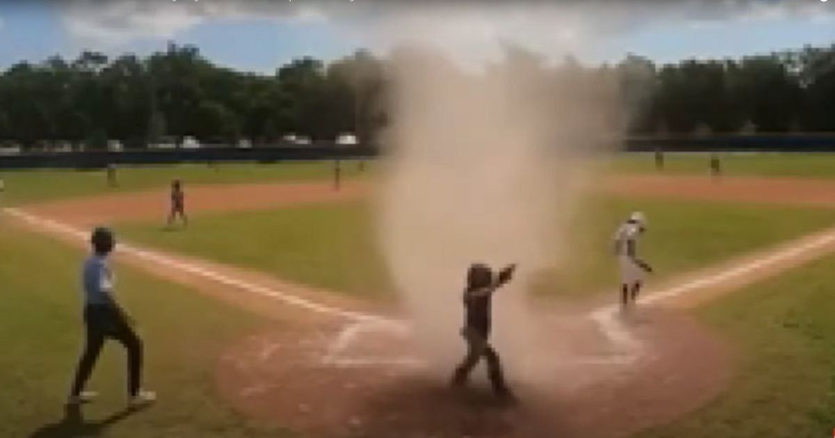 Teenage umpire saves Little League game after dust devil interruption.