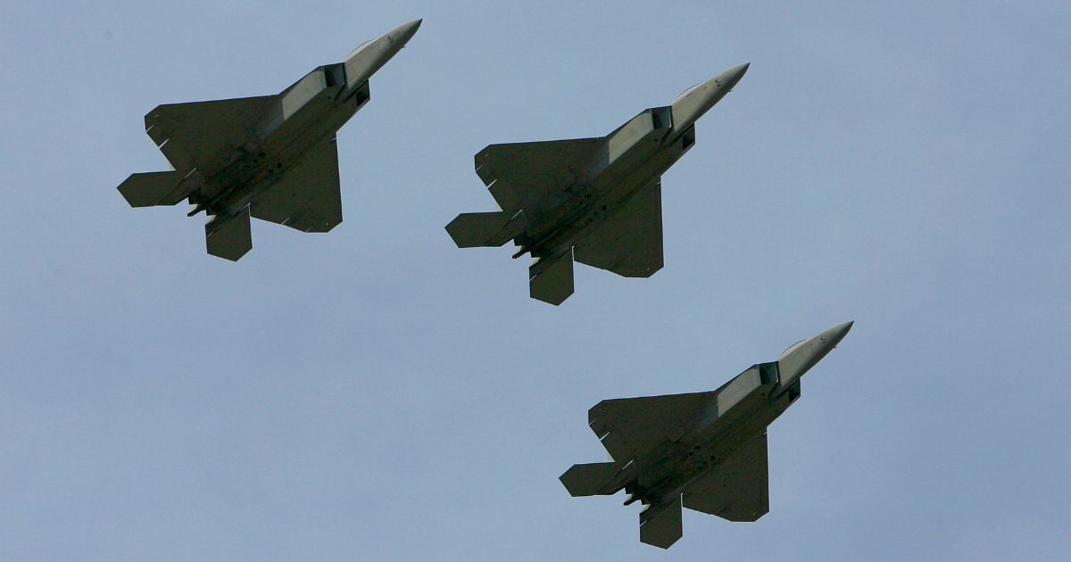 Three F-22 Raptors flow over the track at the NASCAR Nextel Cup Series Coca-Cola 600 in Concord, North Carolina, on May 27, 2007.