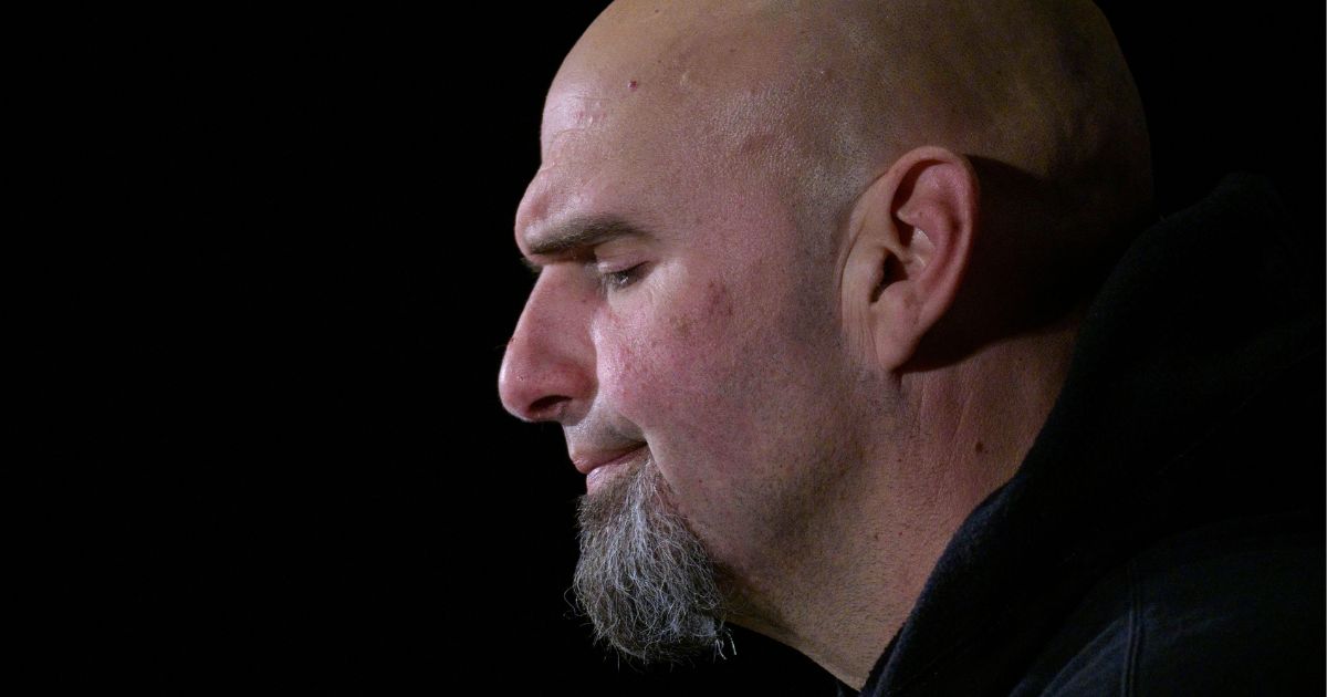 John Fetterman speaks during a rally at Carpenters Union Hall in Pittsburgh on Nov. 7, 2022.