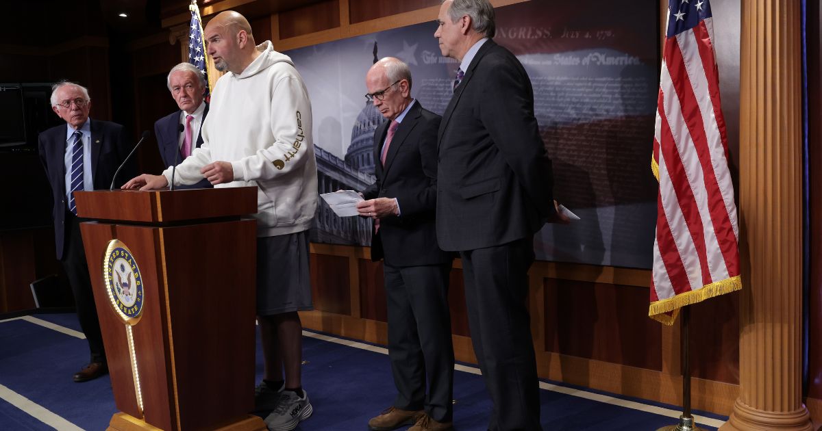 Democratic Sen. John Fetterman of Pennsylvania speaks as, from left, Vermont Sen. Bernie Sanders, Massachusetts Sen. Ed Markey, Vermont Sen. Peter Welch and Oregon Sen. Jeff Merkley listen during a news conference at the U.S. Capitol in Washington on Thursday.