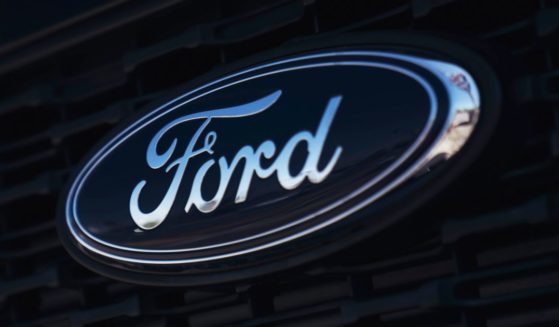 The Ford logo is seen on a new car in a dealership located in Long Beach, California, on Sept. 23, 2022.