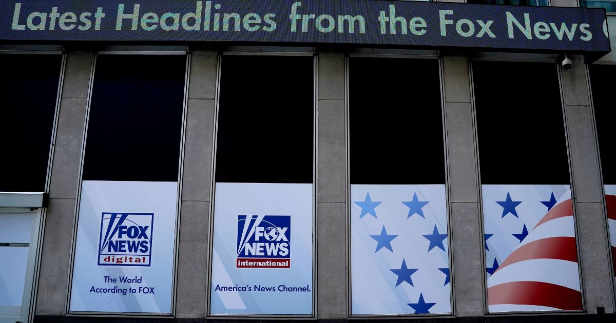 Headlines scroll at the Twenty-First Century Fox Inc headquarters in New York City on April 19.