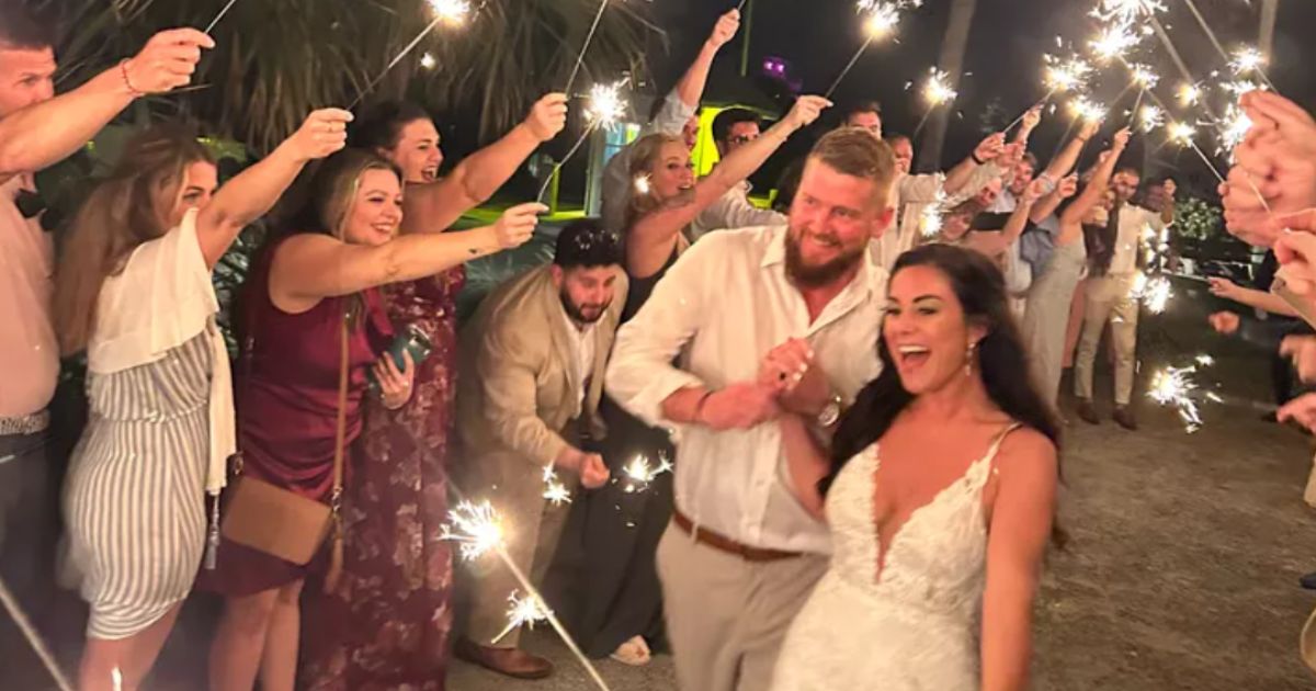 Aric and Samantha Hutchinson are seen at their wedding reception in Folly Beach, South Carolina.