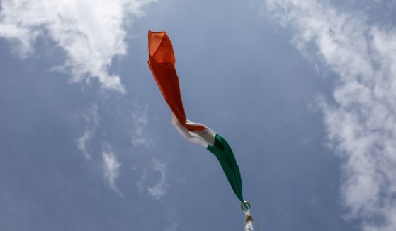 An Irish flag flies in the above stock image.