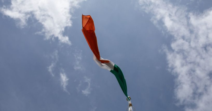 An Irish flag flies in the above stock image.