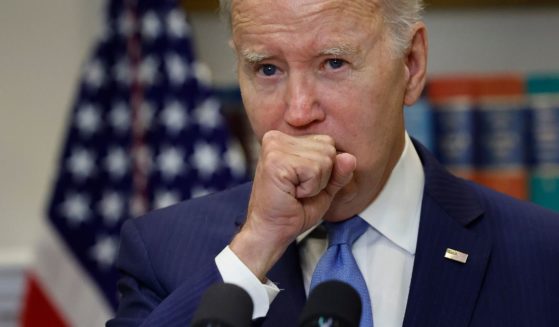 President Joe Biden clears his throat while speaking in the Roosevelt Room at the White House on Wednesday in Washington, D.C.