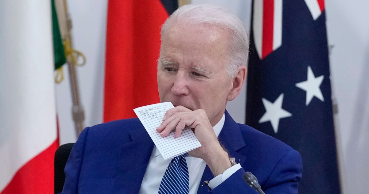 President Joe Biden holds a note card during a meeting with Indonesian President Joko Widodo at the Group of Seven Summit in Hiroshima, Japan, on Saturday.