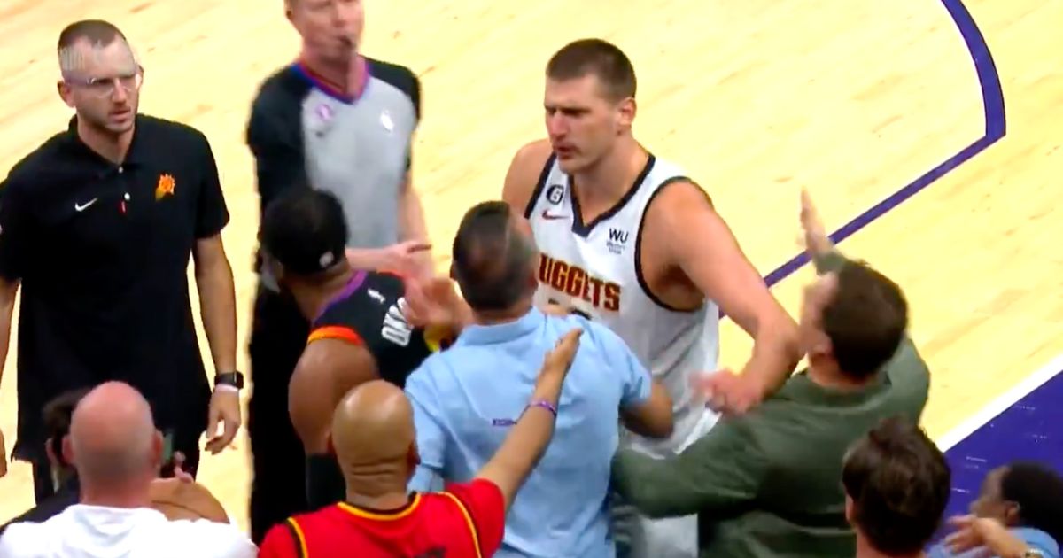 Denver Nuggets superstar Nikola Jokic appears to make contact with Phoenix Suns owner Mat Ishbia.