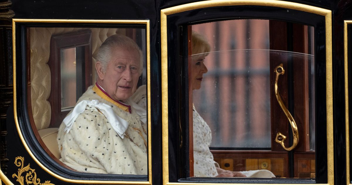 King Charles III and Queen Camilla leave Buckingham Palace ahead of their coronation on Saturday in London.