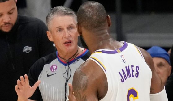During the first half of Game 3 of the NBA basketball Western Conference Final series on Saturday, LeBron James, right, injured a referee.