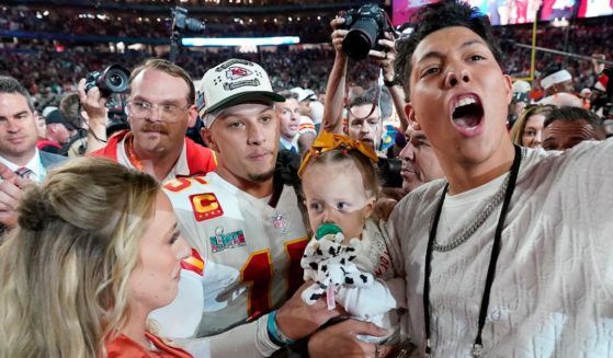 Jackson Mahomes, right, celebrates with his brother, Kansas City Chiefs quarterback Patrick Mahomes, center, sister-in-law Brittany Mahomes, left, and niece Sterling Skye Mahomes after the Chiefs defeated the Philadelphia Eagles in Super Bowl LVII in Glendale, Arizona, on Feb. 12.