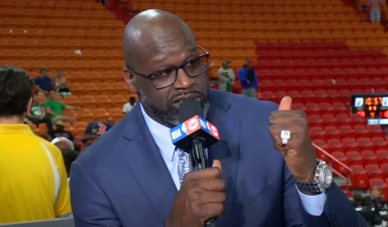 NBA legend Shaquille O'Neal speaks on the set after the Miami Heat lost to the Boston Celtics.