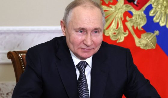 Russian President Vladimir Putin attends a ceremony resuming trams operation in the Azov Sea port city of Mariupol via video conference call in Saint Petersburg on Tuesday.