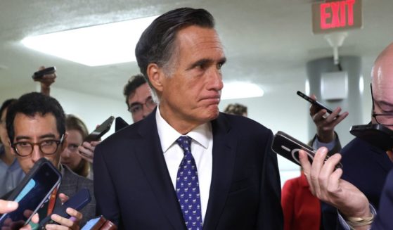 Republican Sen. Mitt Romney of Utah talks to reporters at the U.S. Capitol in Washington on May 2.