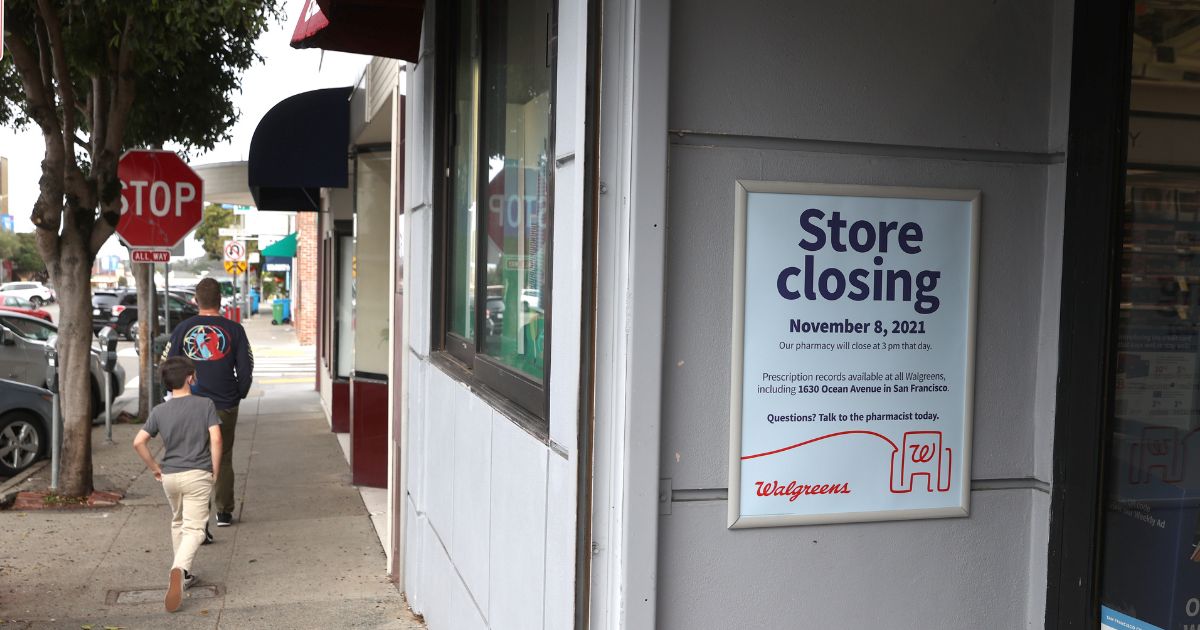 A sign announces the planned closure of a Walgreens drug store in 2021 in San Francisco. Walgreens closed five of its San Francisco stores due to organized retail shoplifting that has plagued its stores in the city. Now, other stores are following suit and fleeing the city.