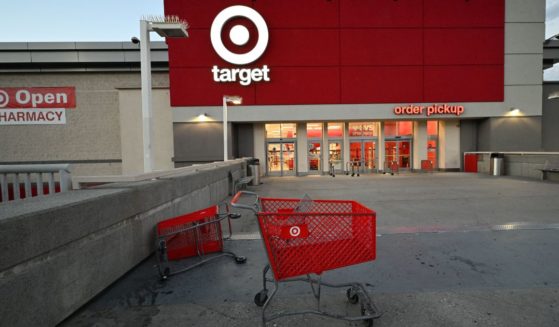 Two shopping carts, one overturned, sit outside of a Target in Los Angeles, California, on April 17, 2022.