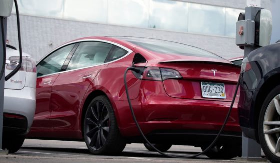 A 2021 Tesla Model 3 sedan sits in the lot of a Tesla dealership in Littleton, Colorado, on June 27, 2021.