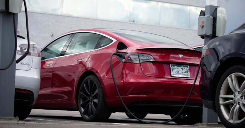 A 2021 Tesla Model 3 sedan sits in the lot of a Tesla dealership in Littleton, Colorado, on June 27, 2021.