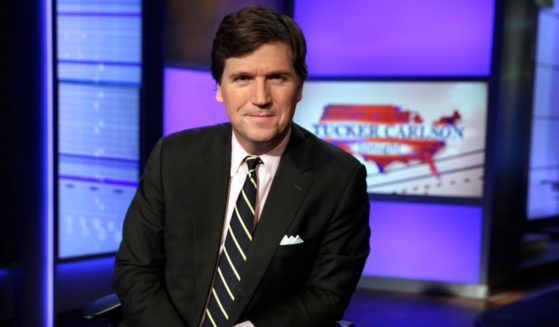 Tucker Carlson poses for photos at the Fox News Channel studios in New York City on March 2, 2017.