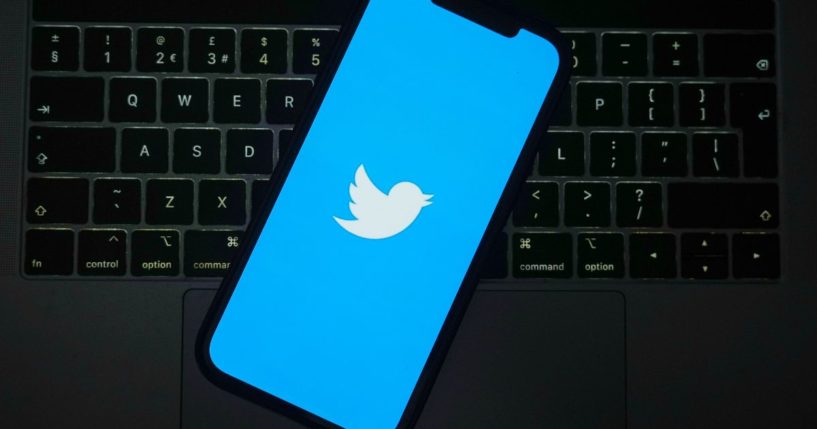 The Twitter logo is seen on a cellphone on April 21 in Knutsford, England.