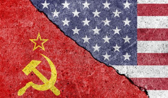The Soviet and American flags are seen in the above stock image.