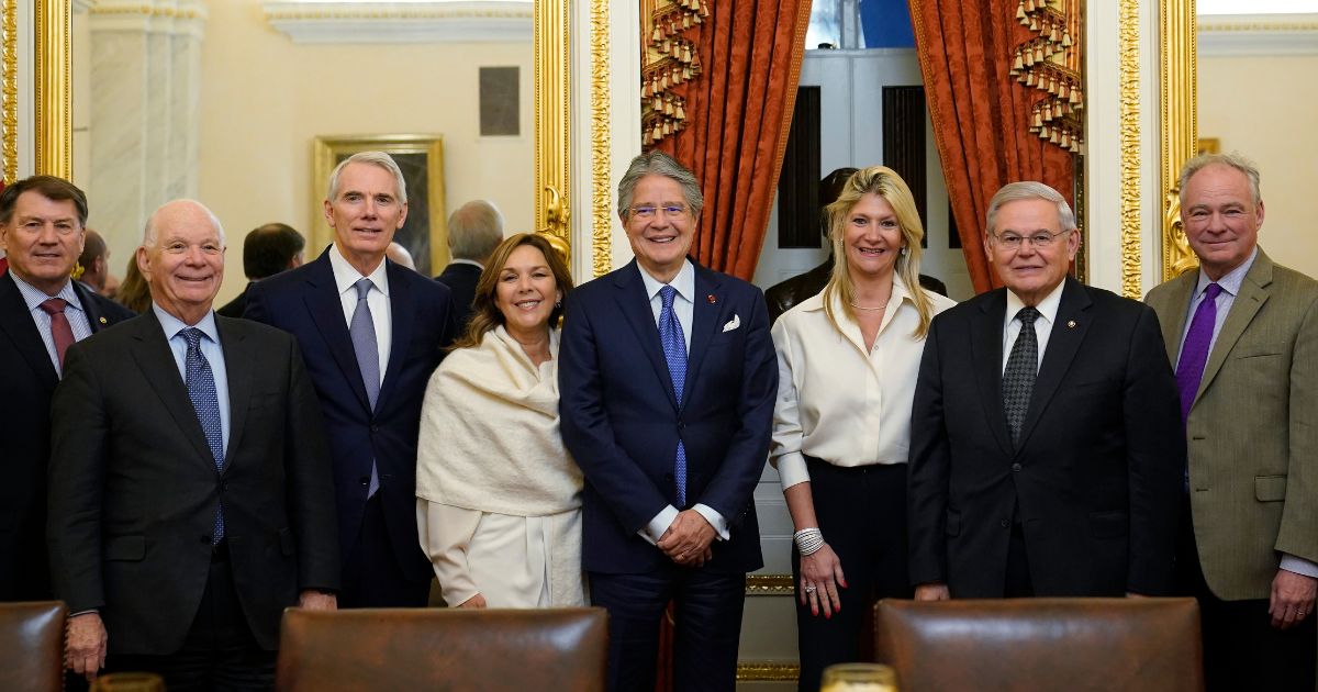 New Jersey Democratic Sen. Bob Menendez, second from right, poses for a photo with members of the Senate Foreign Relations Committee on Capitol Hill on Dec. 20.