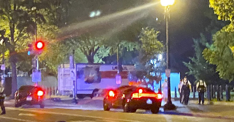 A box truck is seen crashed into a security barrier at a park across from the White House in Washington on Monday night.