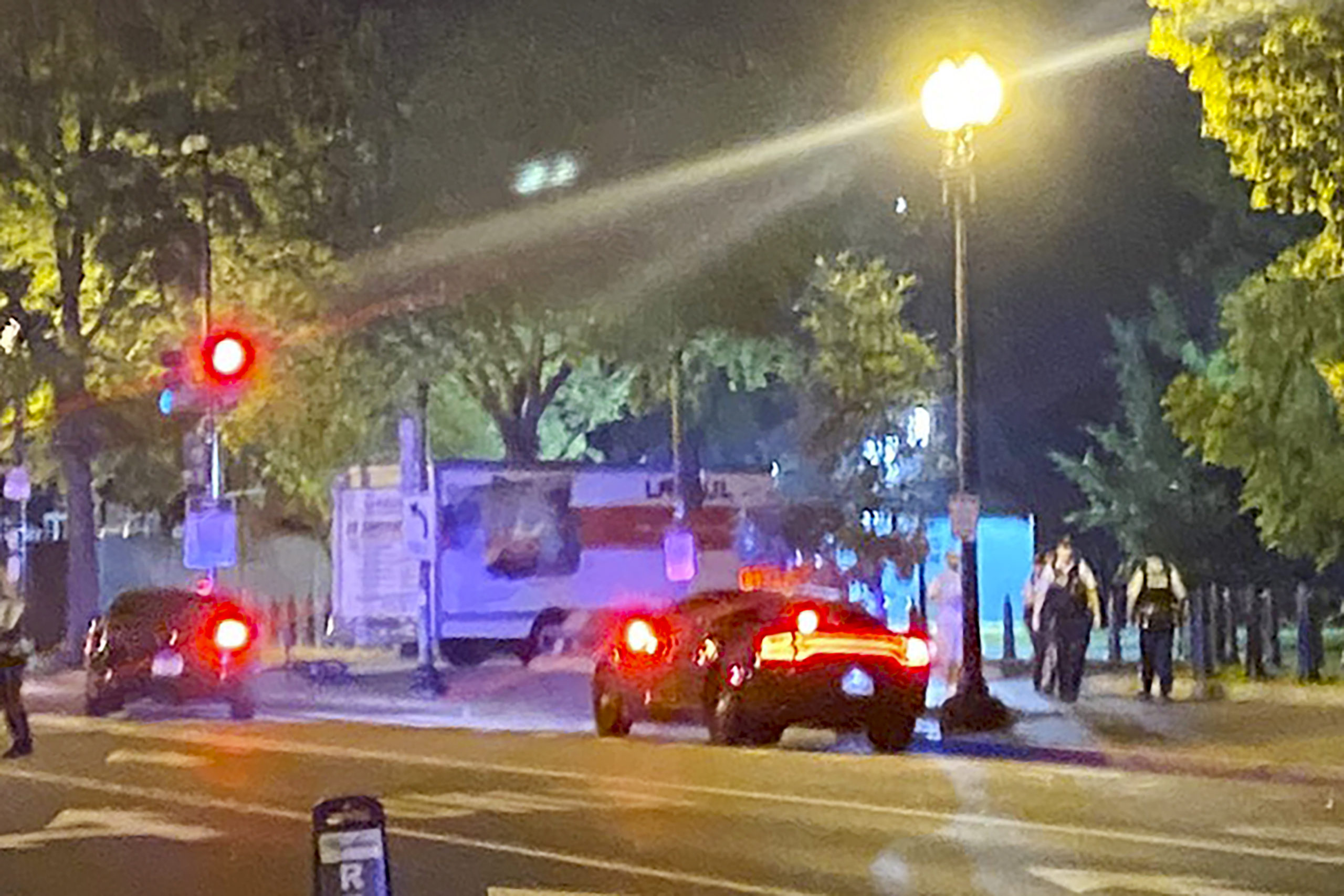 A box truck is seen crashed into a security barrier at a park across from the White House in Washington on Monday night.