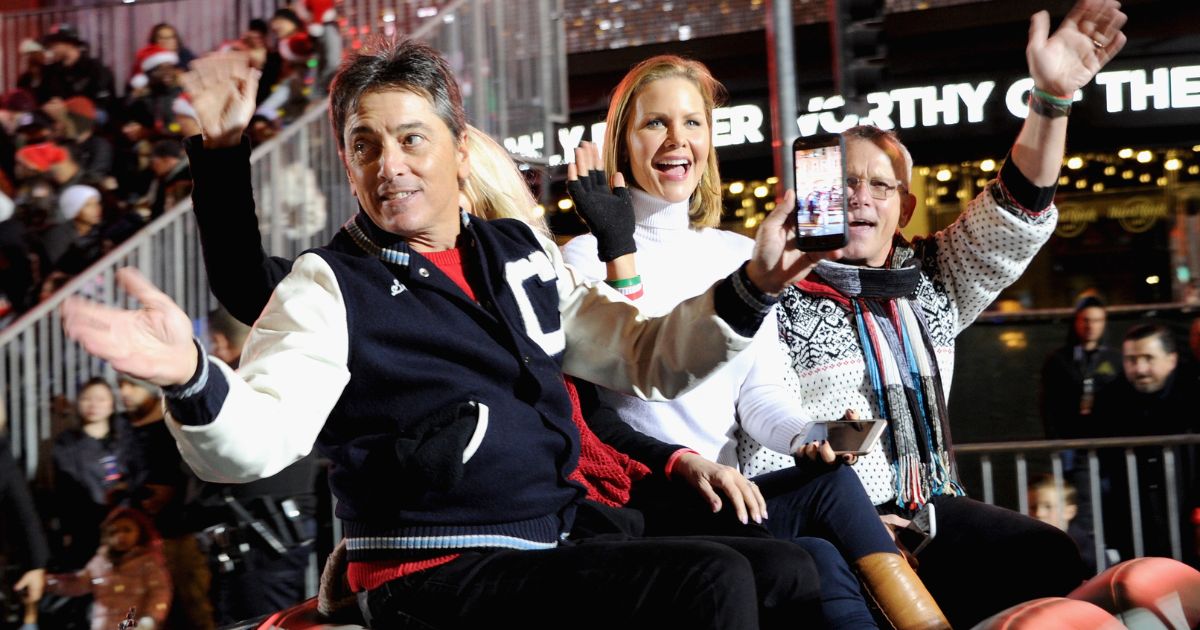 Scott Baio, left, Josie Davis, middle, and Willie Aames, right, ride in the 88th Annual Hollywood Christmas Parade held on Dec. 1, 2019, in Hollywood, California.