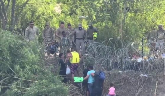 Texas Department of Public Safety and the National Guard was filmed as they stopped migrants from entering.